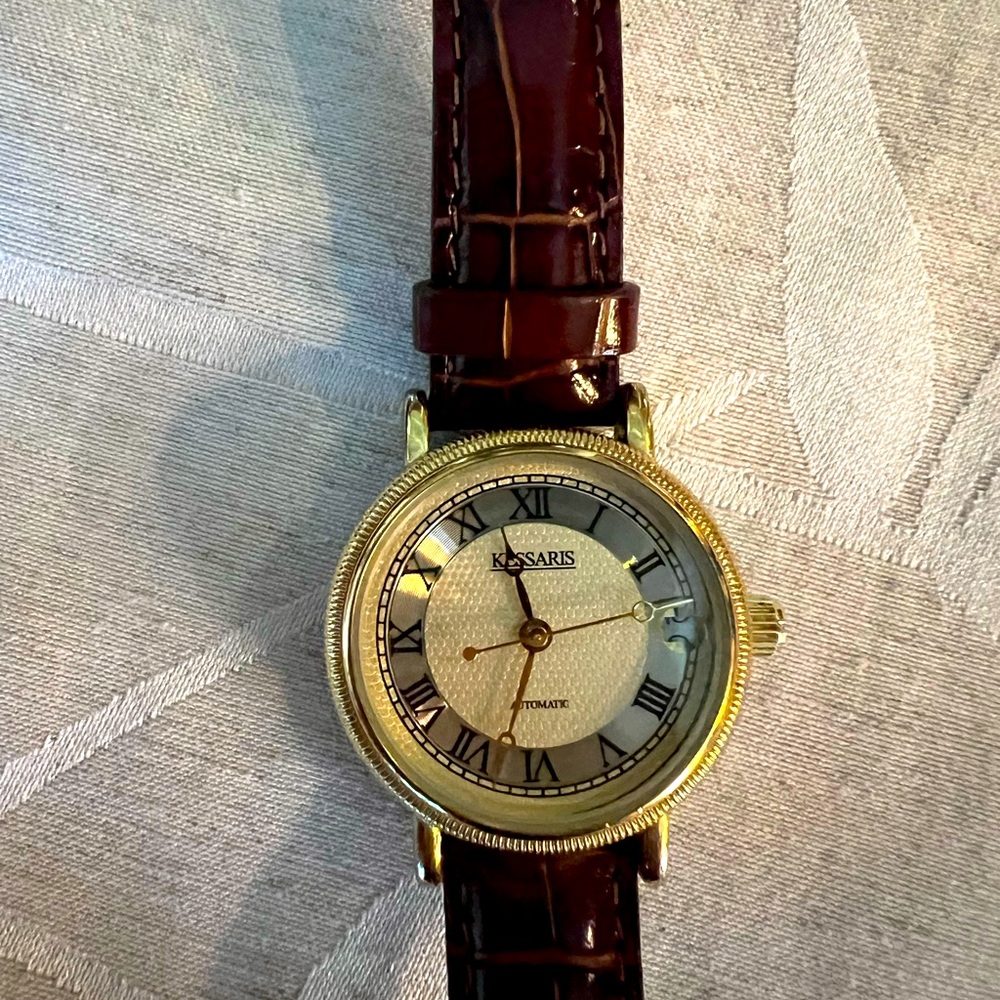 Kessaris self-wind gold tone watch